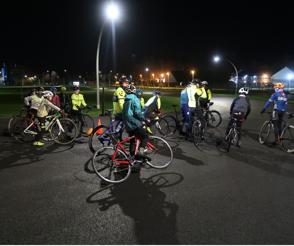 Group of youth cyclists at a race coaching session.